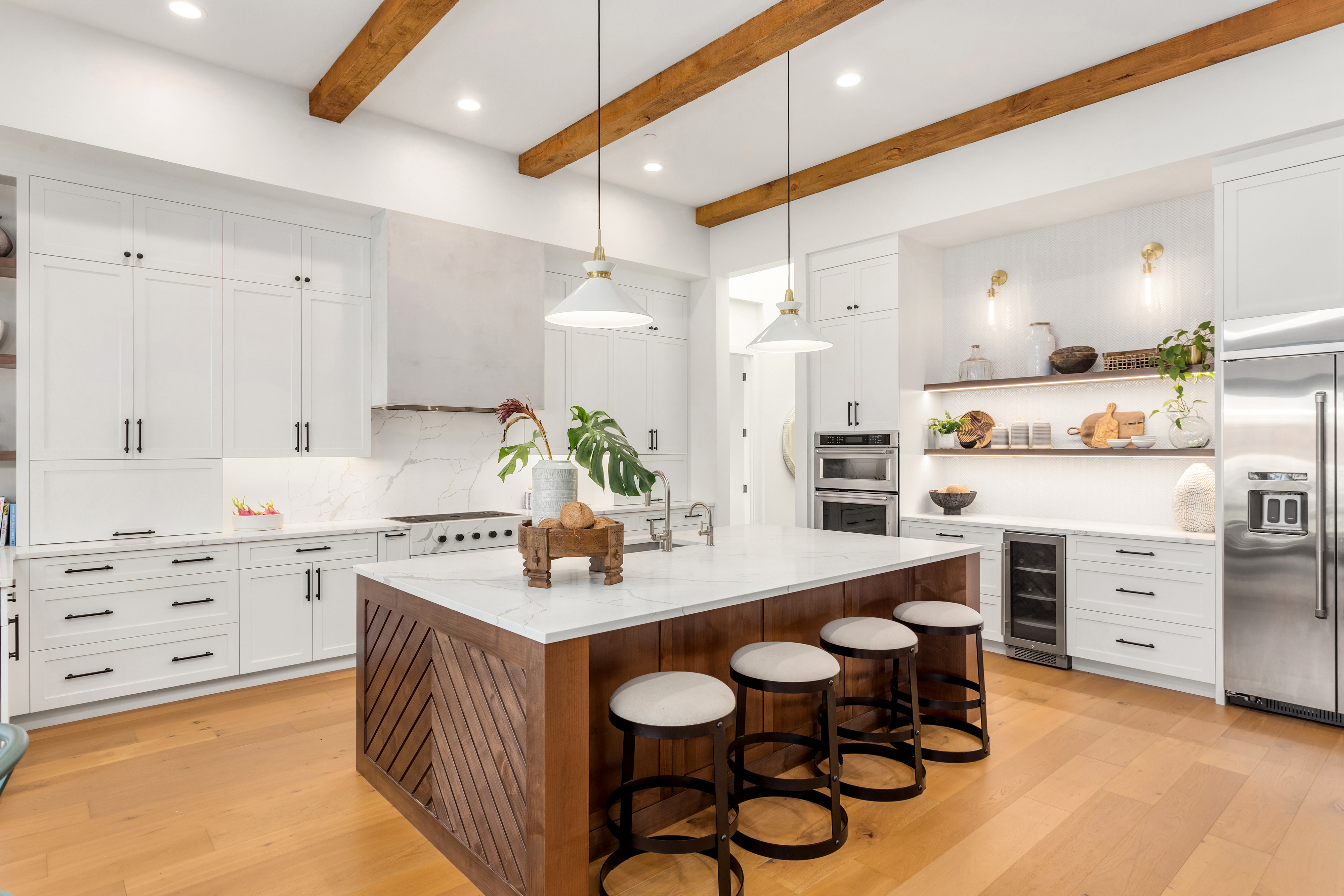 Custom kitchen remodel Bay Area — black cabinetry with marble waterfall island by Mayer's Construction