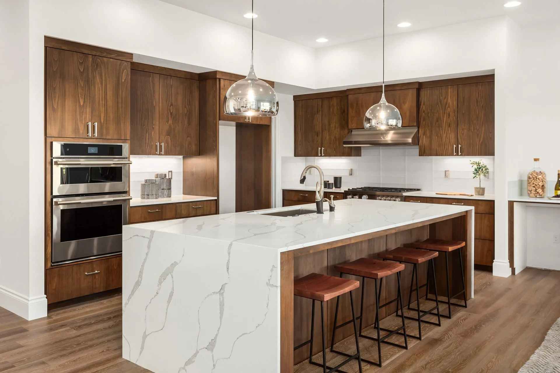 Custom kitchen remodel — white shaker cabinets, gold hardware, quartz counters by Mayer's Construction